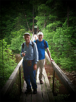 Crossing the creek on one of many swinging bridges